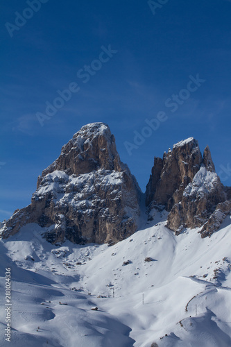 Grohmann Mountain and Cinquedita in the Dolomites above Val Gardena. Mountains covered in Snow in the middle of Winter