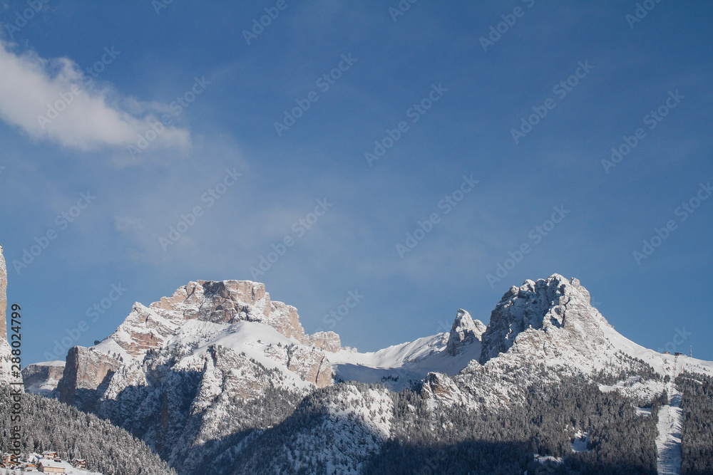 Crespeina Mountain and the Cirspitzen in Winter, located in the Dolomites. Landscape seen from La Selva in Selva di Val Gardena, Wolkenstein in Gröden