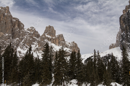 Sella, Piz ciavazes in the Dolomites beneath Sass Pordoi on the Sellajoch Road in the Dolomites. Winter Landscape of snow covered Mountains. photo