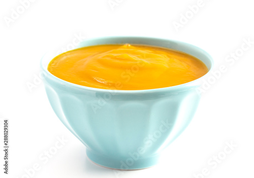 Bowl of Healthy Sweet Potato and Sage Soup Isolated on a White Background