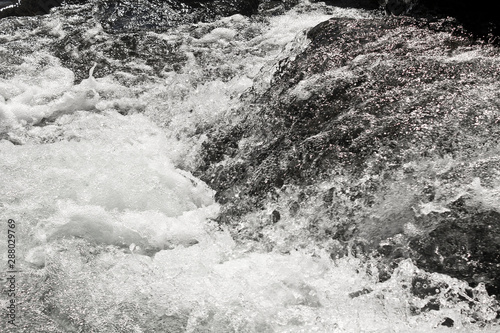 Fast flowing Storebottåne river water of the Vavatn lake in Hemsedal, Buskerud, Norway. photo