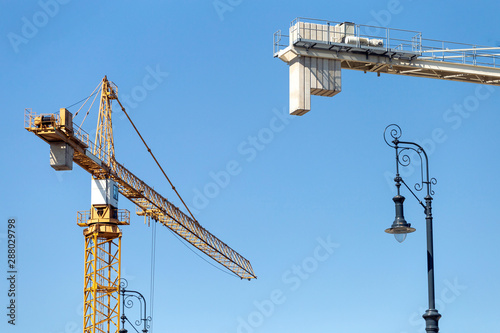 Cranes on a construction site photo