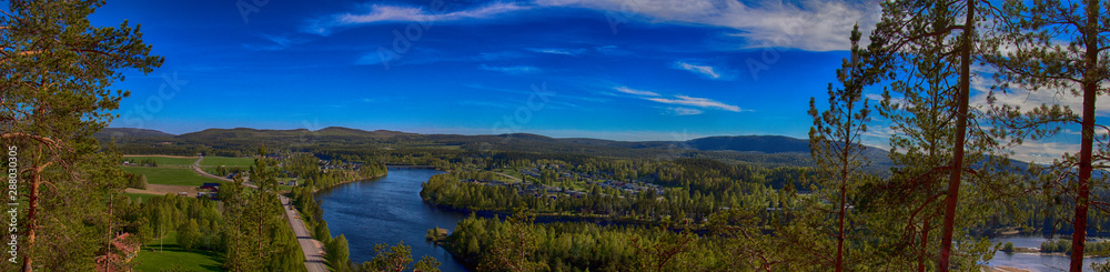 Älvsbyn from the mountain. Beautiful landscape. Colourful photograph. A city in the north of Sweden in summer time. Panorama Photograph.