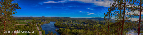 Älvsbyn from the mountain. Beautiful landscape. Colourful photograph. A city in the north of Sweden in summer time. Panorama Photograph.