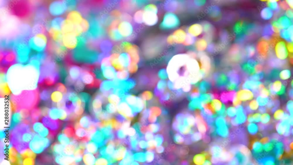 Closeup view of beautiful defocused blurry colorful shiny and sparkling glitter decorations. Camera moving from left side to right. Full hd video footage. Closeup view of beautiful defocused blurry colorful shiny and sparkling glitter decorations. Camera moving from left side to right. Full hd video footage.