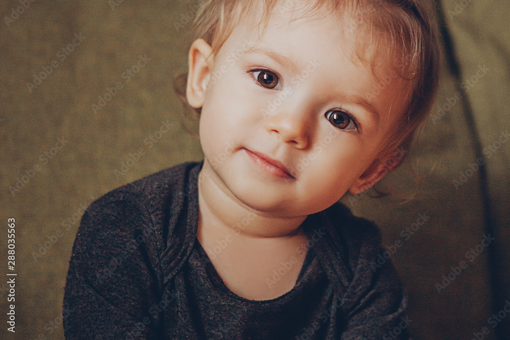 portrait of cute charismatic baby with a gentle smile in vintage style, taken at home in the nursery, stylized for home cinematic photography portrait of cute charismatic baby with a gentle smile in vintage style, taken at home in the nursery, stylized for home cinematic photography