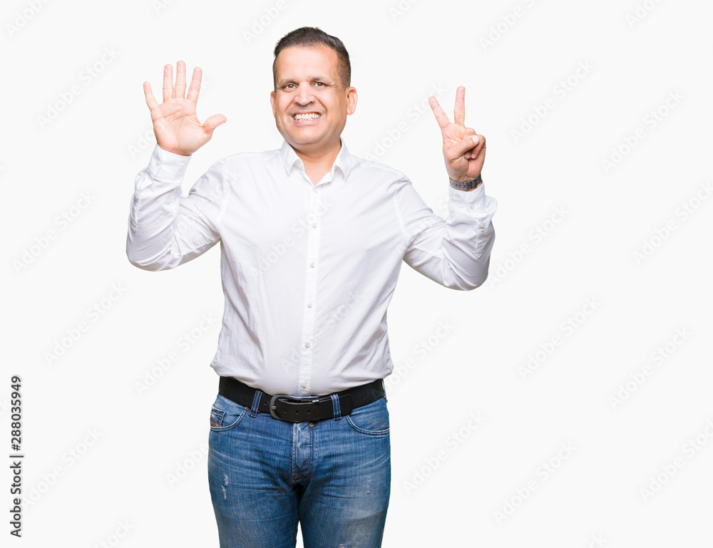 Naklejka premium Middle age arab elegant man over isolated background showing and pointing up with fingers number seven while smiling confident and happy.
