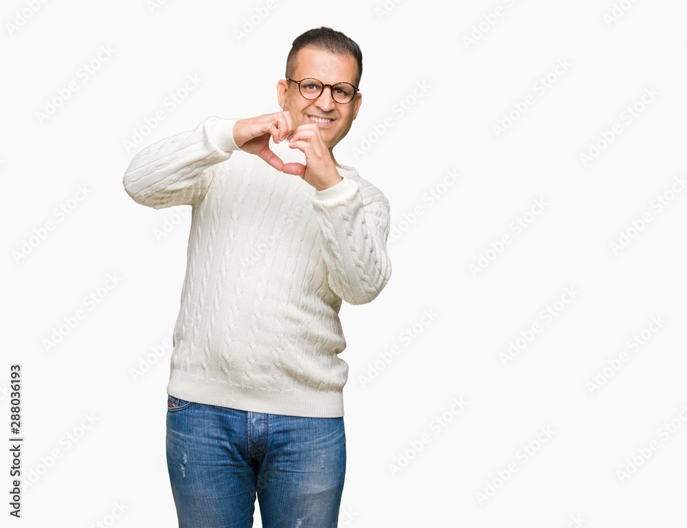 Middle age arab man wearing glasses over isolated background smiling in love showing heart symbol and shape with hands. Romantic concept. Middle age arab man wearing glasses over isolated background smiling in love showing heart symbol and shape with hands. Romantic concept.