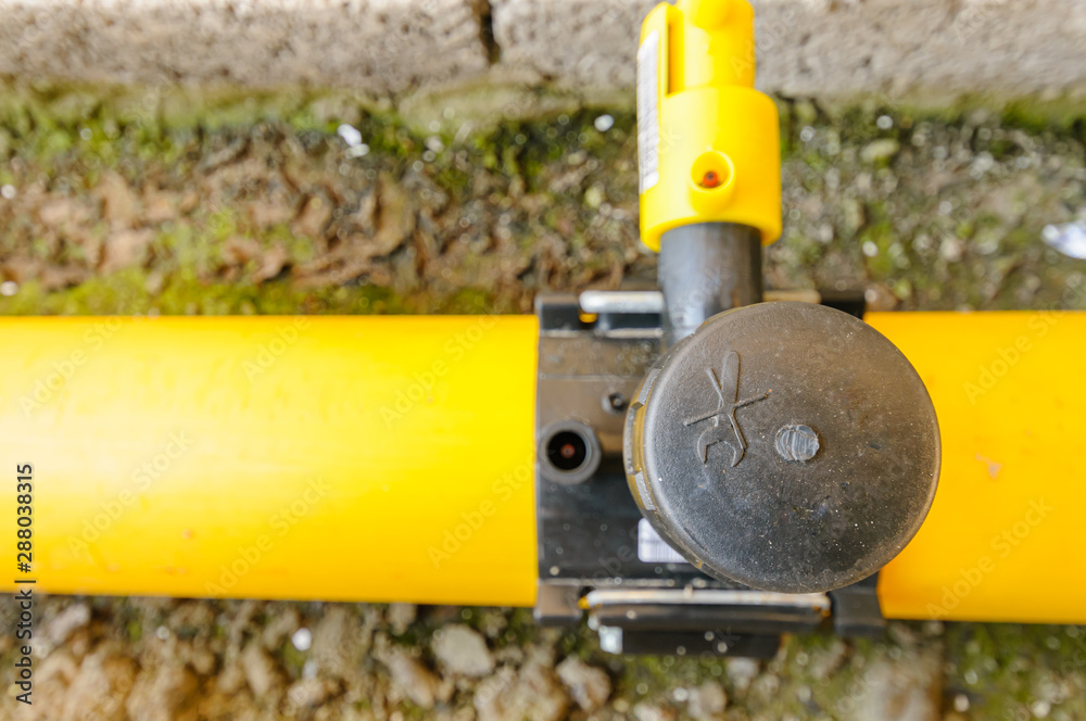 Junction of main gas pipe to tap off supply pipe. Stock Photo | Adobe Stock