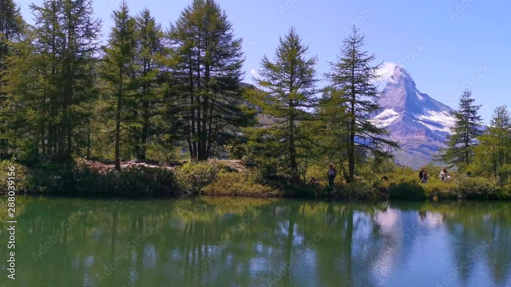 Beautiful reflections of the Matterhorn mountain peak in Grindjisee lake in Zermatt, Switzerland Beautiful reflections of the Matterhorn mountain peak in Grindjisee lake in Zermatt, Switzerland