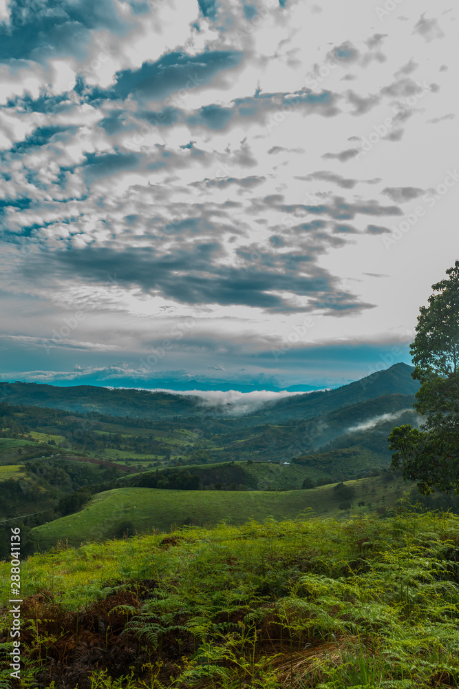 THE MOUNTAINOUS LANDSCAPE AT DAWN THE MOUNTAINOUS LANDSCAPE AT DAWN