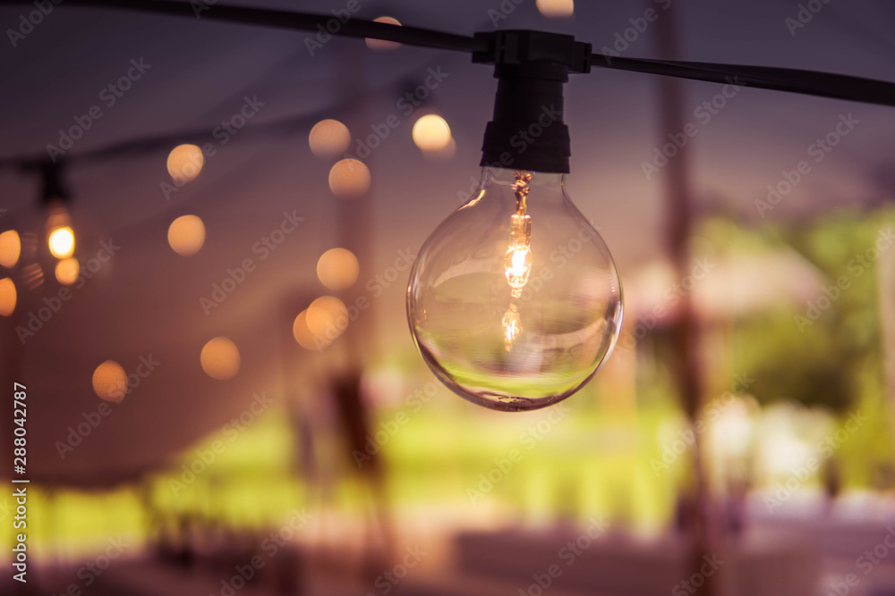 Image of glowing light bulb on dark background Image of glowing light bulb on dark background