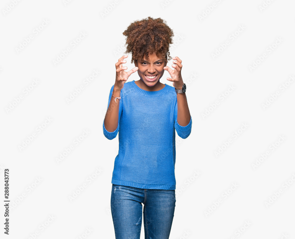 Beautiful young african american woman over isolated background Shouting frustrated with rage, hands trying to strangle, yelling mad Beautiful young african american woman over isolated background Shouting frustrated with rage, hands trying to strangle, yelling mad