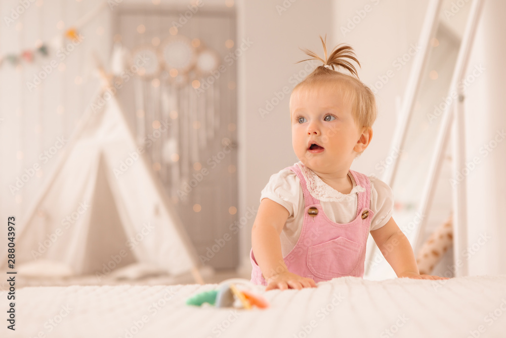 baby girl in the nursery playing,bright children's room, textiles for children's room baby girl in the nursery playing,bright children's room, textiles for children's room
