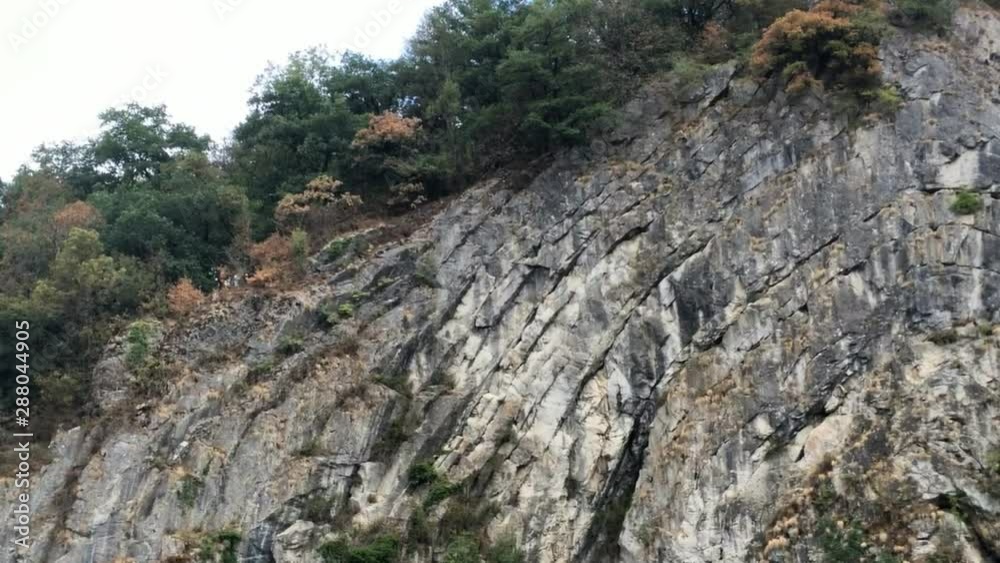 Durbuy, Belgium. Interesting folded sliced sedimentary rock formation in city. Beautiful town Durbuy. Popular tourist destination. Durbuy, Belgium. Interesting folded sliced sedimentary rock formation in city. Beautiful town Durbuy. Popular tourist destination.
