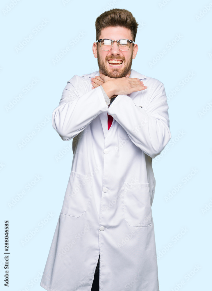 Young handsome scientist man wearing glasses shouting and suffocate because painful strangle. Health problem. Asphyxiate and suicide concept. Young handsome scientist man wearing glasses shouting and suffocate because painful strangle. Health problem. Asphyxiate and suicide concept.
