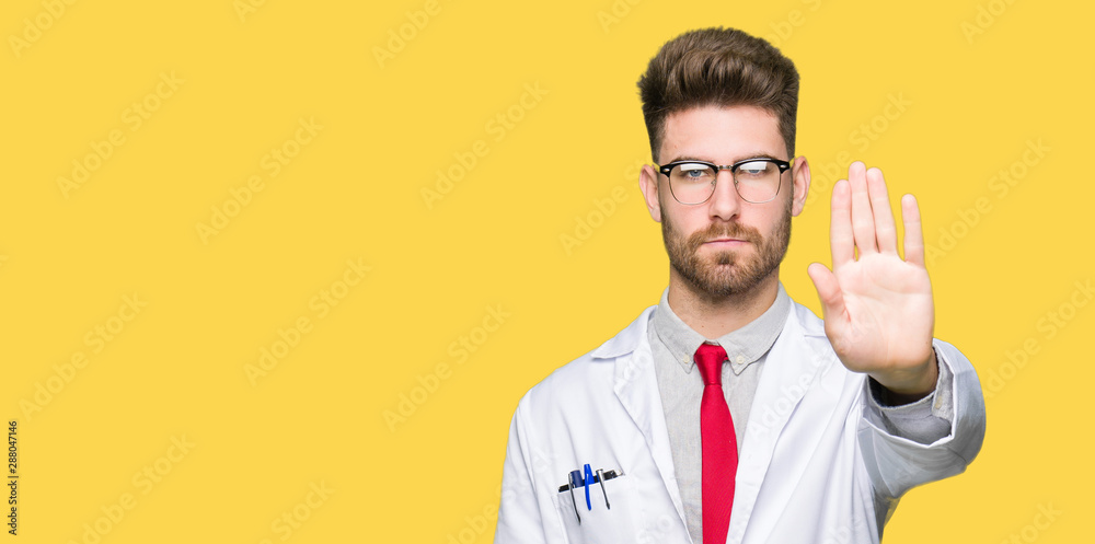 Young handsome scientist man wearing glasses doing stop sing with palm of the hand. Warning expression with negative and serious gesture on the face. Young handsome scientist man wearing glasses doing stop sing with palm of the hand. Warning expression with negative and serious gesture on the face.