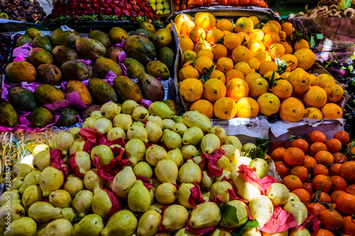 Ripe mandarins, guava, mango and oranges for sale on a fruit market