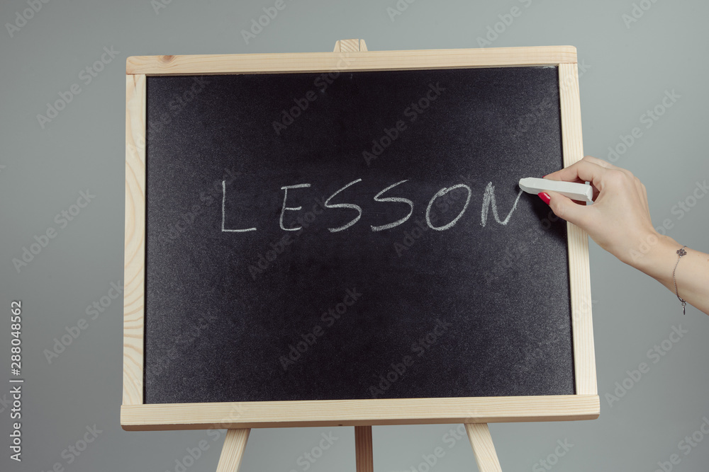 © Andrzej Wilusz - Lesson written in white chalk on a black chalkboard © Andrzej Wilusz - Lesson written in white chalk on a black chalkboard