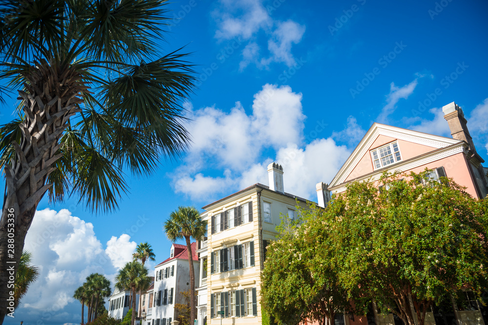 Fototapeta premium Brightly colored colonial architecture in the historical heart of the Battery neighborhood in Charleston, South Carolina, USA