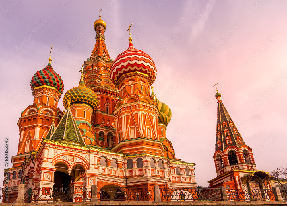 St. Basils Cathedral on the Red Square beautifully highlighted by sun at sunrise, golden hour, Moscow, Russia