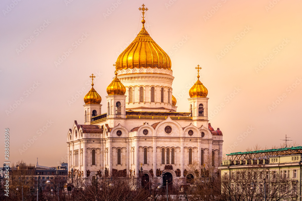 Closeup at beautiful Cathedral of Christ the Saviour with decorative domes at spectacular golden sunrise, Moscow, Russia
