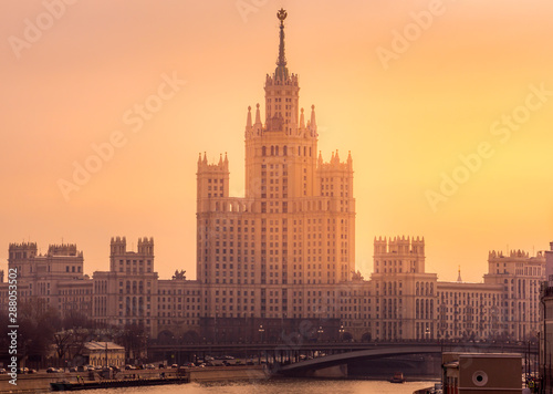 View at Kotelnicheskaya Embankment Building and Moskva River, during beautiful golden sunrise, Moscow, Russia