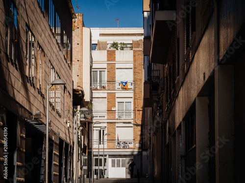 Catalan flag hanged on a balcony of apartment building in Barcelona © ifeelstock