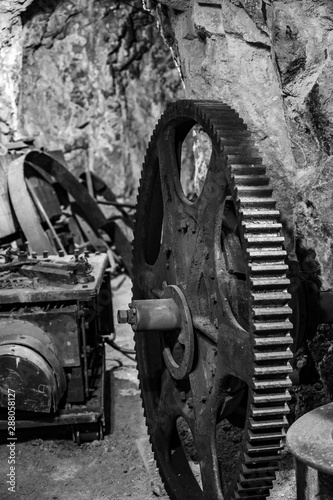 Abandoned gears and equipment inside a closed gold mine