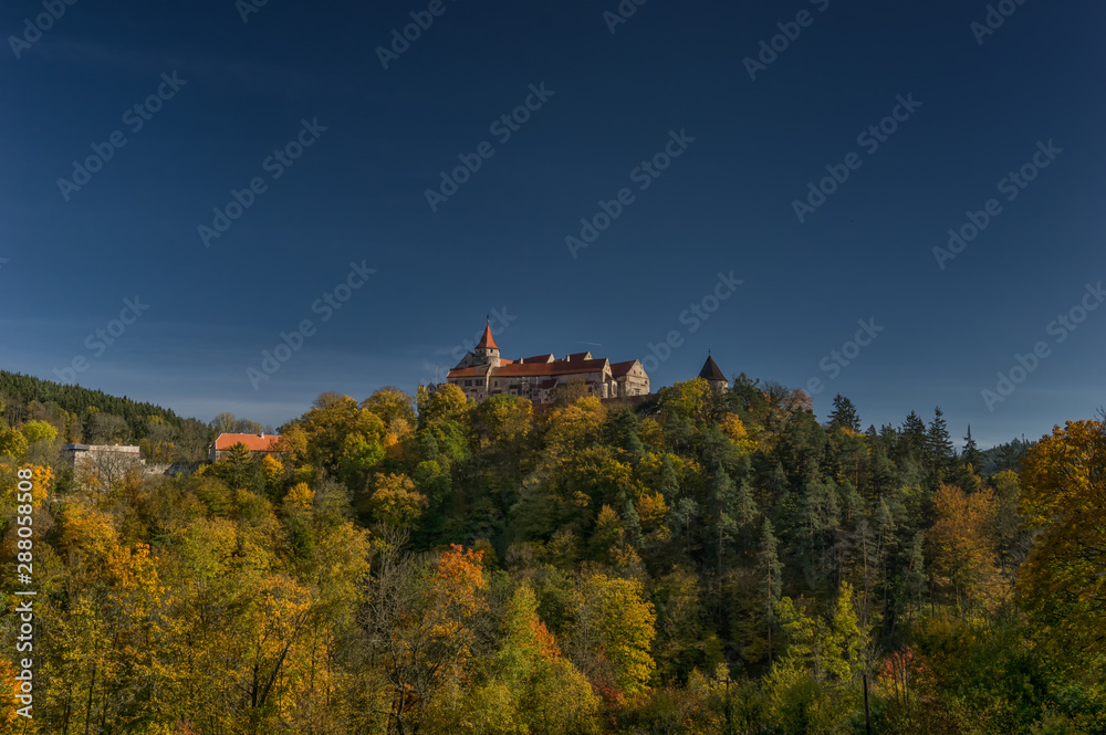Landscape view on the gothic Castle Pernstejn during autumn time - Czech Republic