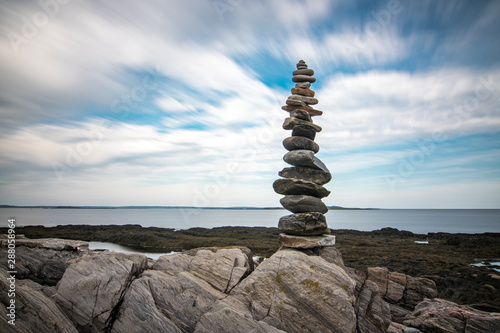 Balanced tower of rocks on the coast 