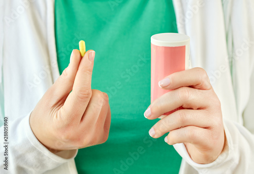 hand showing a pill