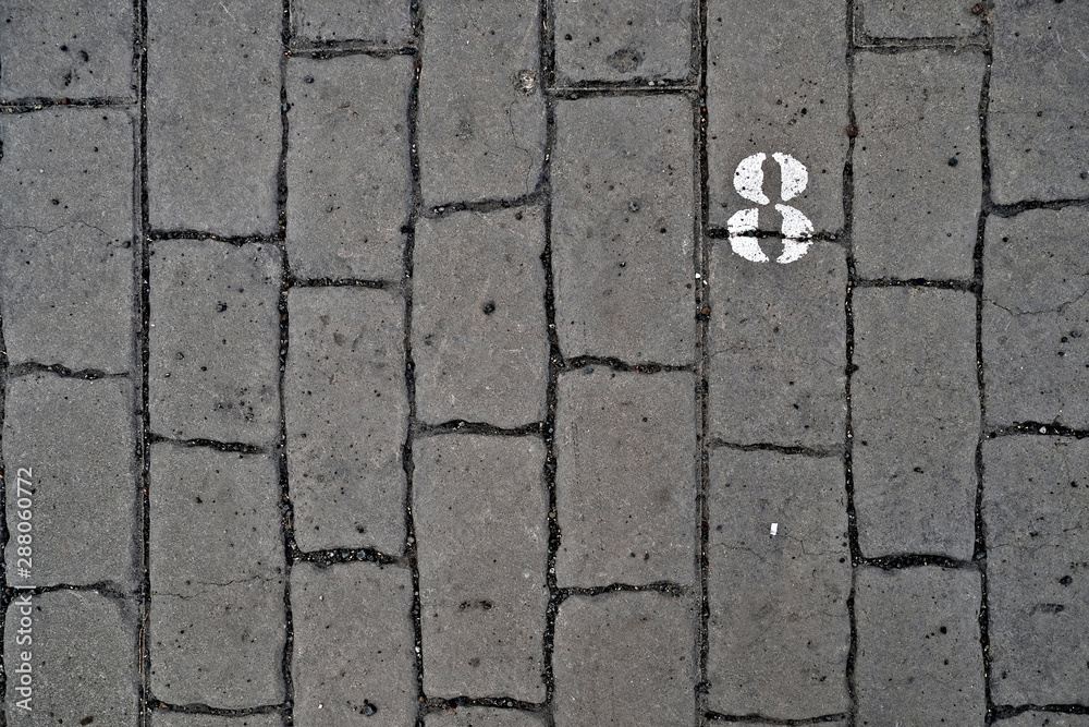 Obraz premium 8, number eight, white stencil number on cobblestone surface.