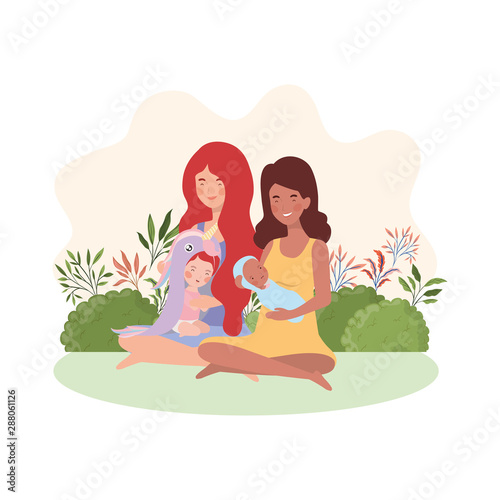 interracial pregnancy mothers seated lifting babies in the camp