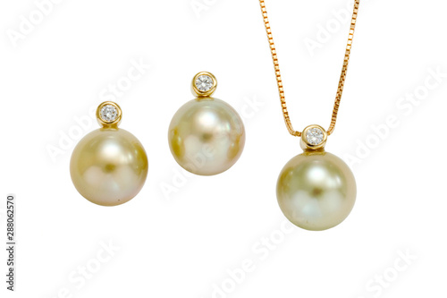 Large light colored Tahitian pearls accented with a bezel set diamond make up this post earring and pendent set. On a white background with no shadow.