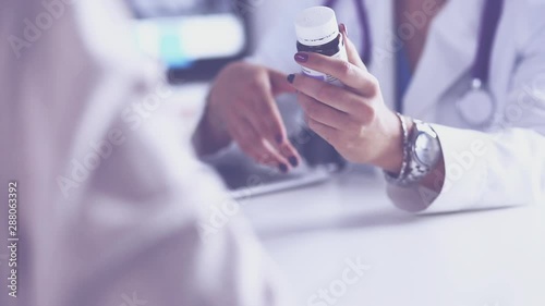 Doctor Talk to a Patient Woman About Tablet Pills Work in Hospital