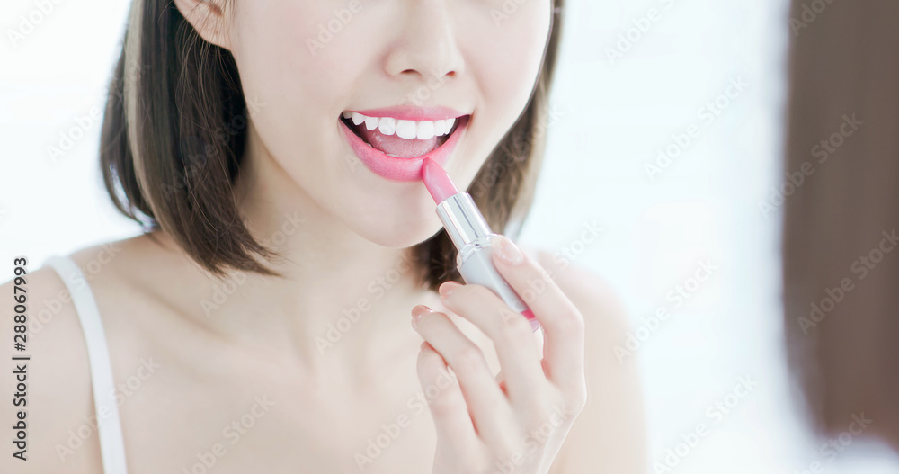 Beauty woman use lipstick Beauty woman use lipstick