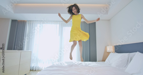Fashion lady jump on bed