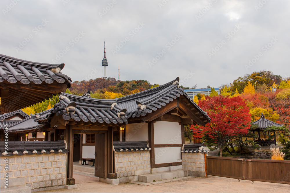 Autumn season of  Namsangol Hanok Village with seoul tower  in Seoul South Korea..