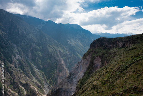 From the heights of Mirador Cruz del Condor, the large Condor birds of Peru nest on the rocky ledges to the sides of the rugged cliff faces lining the valley below