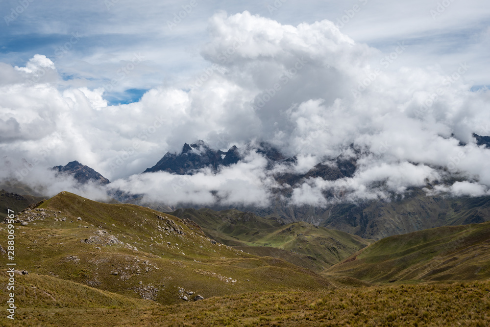 Surrounded by a maze of hills and mountains, the clouds of the Sacred Valley near Ollantaytambo have nowhere to go but weave around creating beautiful patterns.