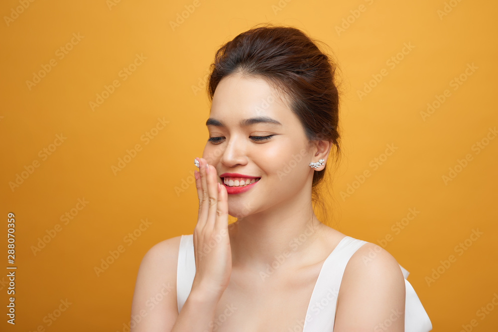 Surprised model woman isolated on yellow background. Laughing girl with red lips. Surprised model woman isolated on yellow background. Laughing girl with red lips.
