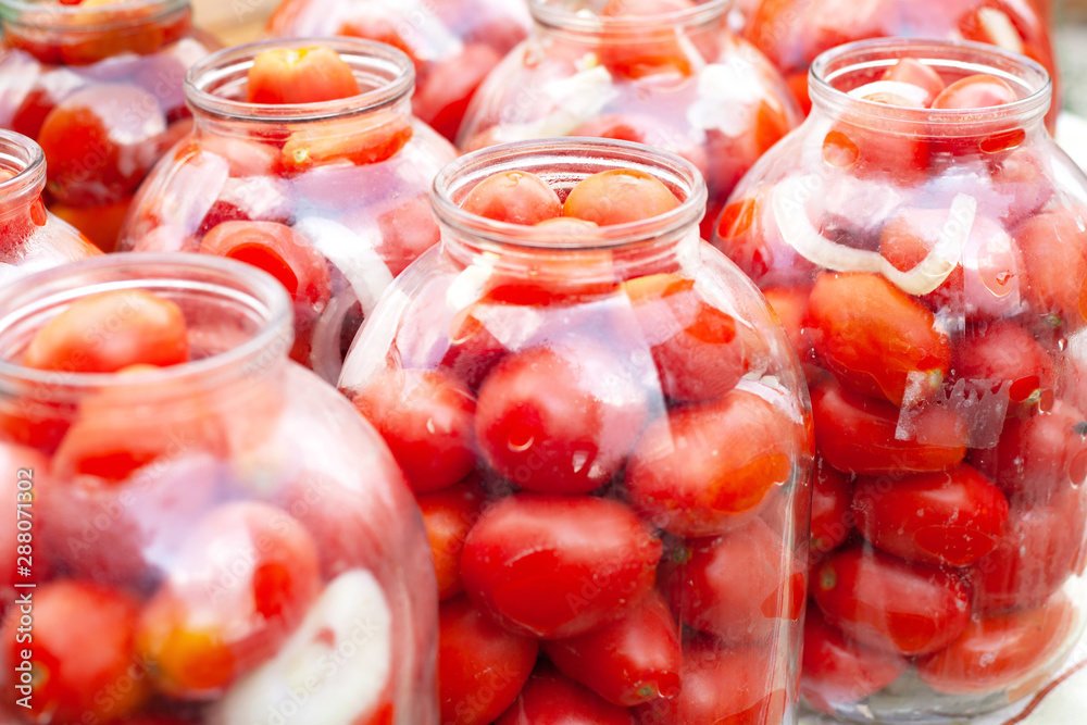 pickled (canned) red  tomatoes in jars