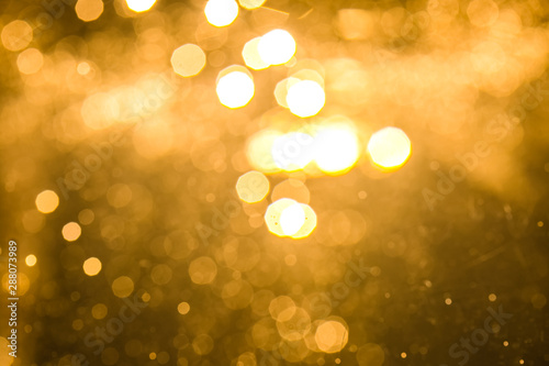 Abstract gold bokeh with black