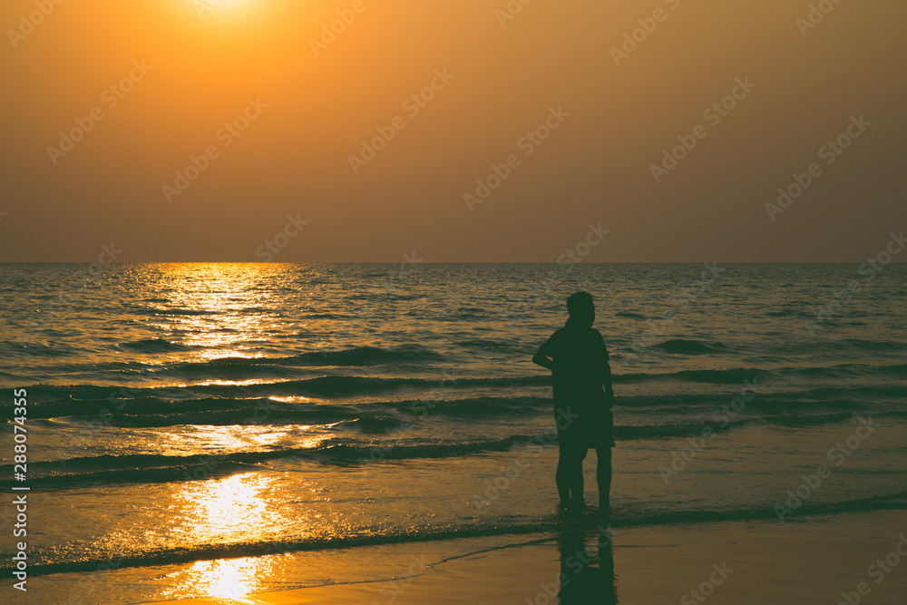Siluate lovers and beach before sunset Siluate lovers and beach before sunset