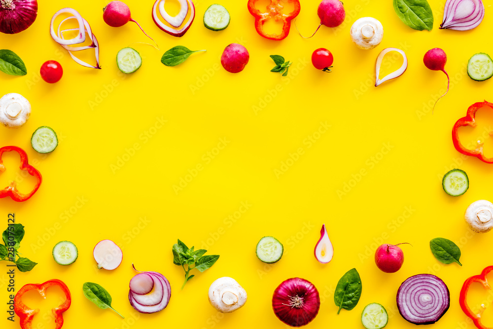 Sliced, cut, chopped vegetables frame on yellow background top view copyspace Sliced, cut, chopped vegetables frame on yellow background top view copyspace