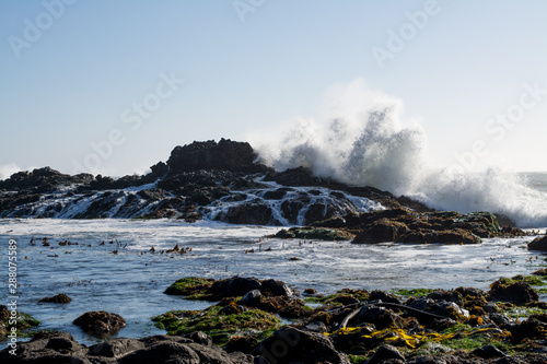 huge waves crashing over Rocky California coast.