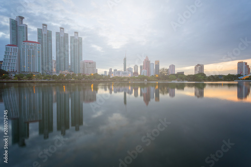 City building with water reflection before sunset