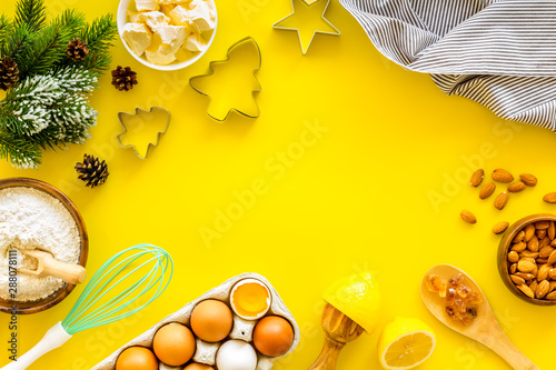 Baking frame. Ingredients and utensil on yellow background top view copy space