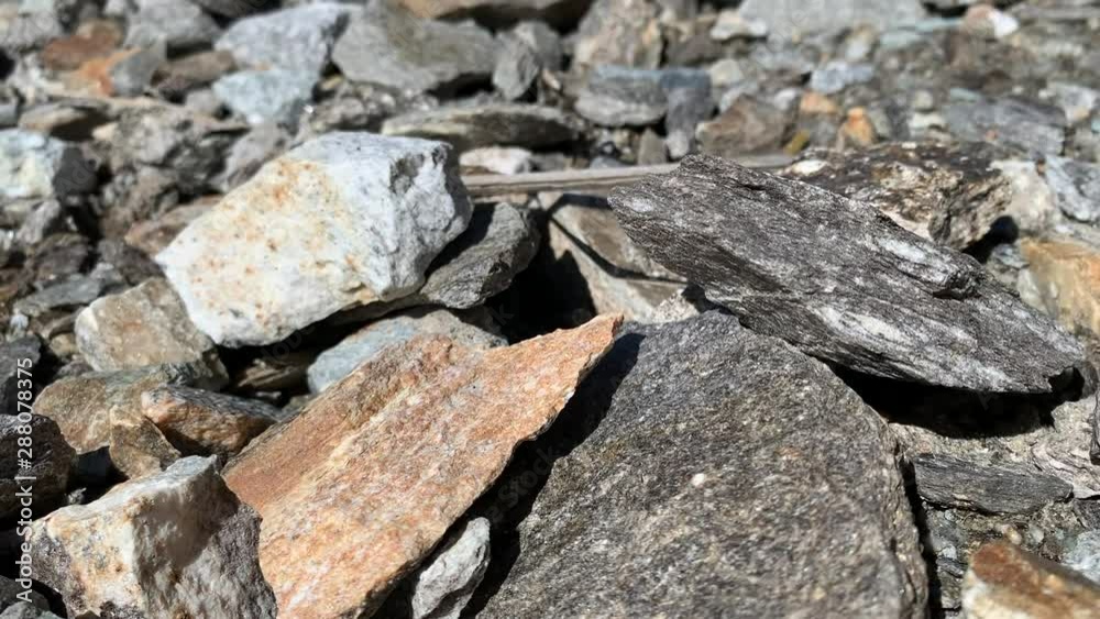 Rocks in Grey, Orange, Brown on Swiss Mountain Close up Rocks in Grey, Orange, Brown on Swiss Mountain Close up